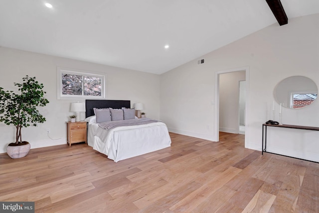 bedroom featuring lofted ceiling with beams, light wood finished floors, recessed lighting, and baseboards