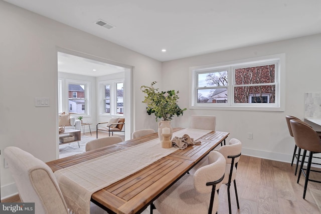 dining room with recessed lighting, light wood-type flooring, visible vents, and baseboards