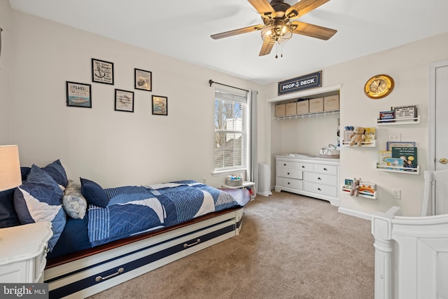 bedroom featuring carpet, baseboards, and a ceiling fan