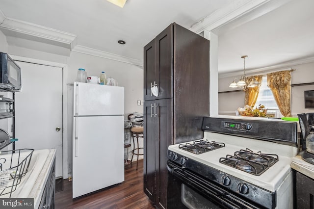 kitchen with white appliances, ornamental molding, light countertops, and dark wood-style flooring