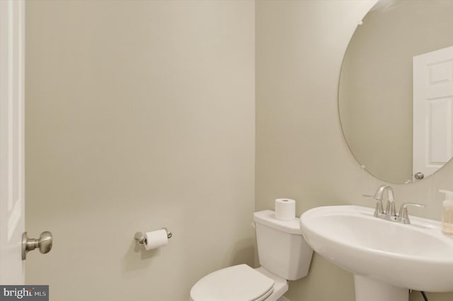 bathroom with a sink and toilet