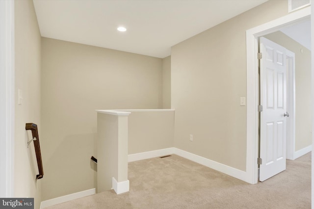 laundry area with recessed lighting, light carpet, visible vents, and baseboards