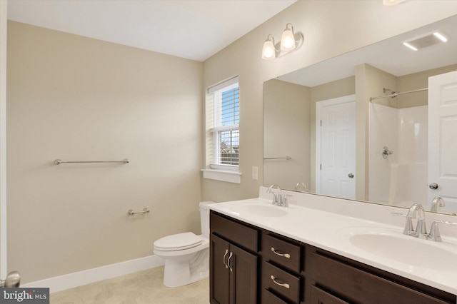 full bathroom with a shower, a sink, toilet, and baseboards