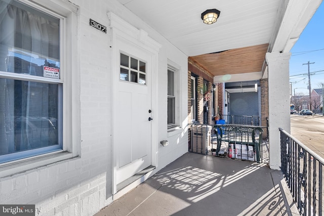 entrance to property with brick siding