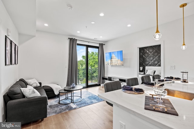 living room featuring light wood-style floors and recessed lighting