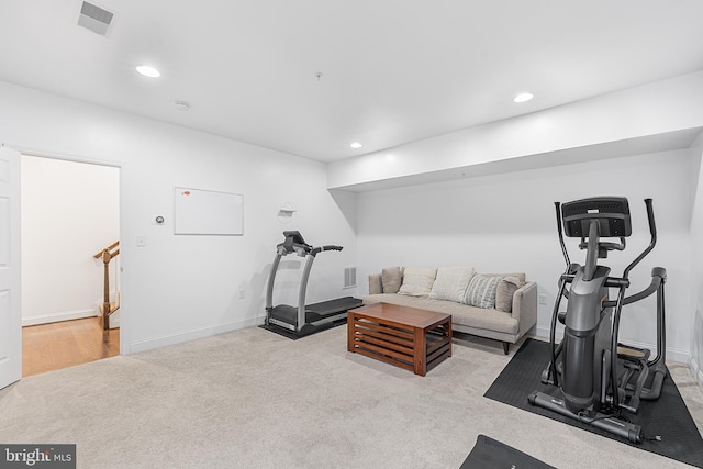 exercise room with recessed lighting, visible vents, and carpet