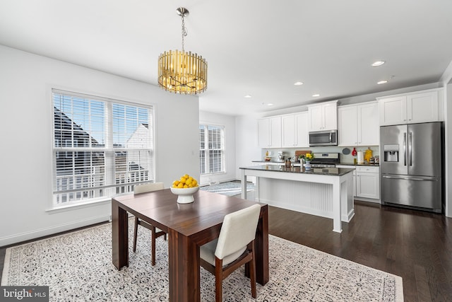 dining room featuring a notable chandelier, baseboards, dark wood-style flooring, and recessed lighting