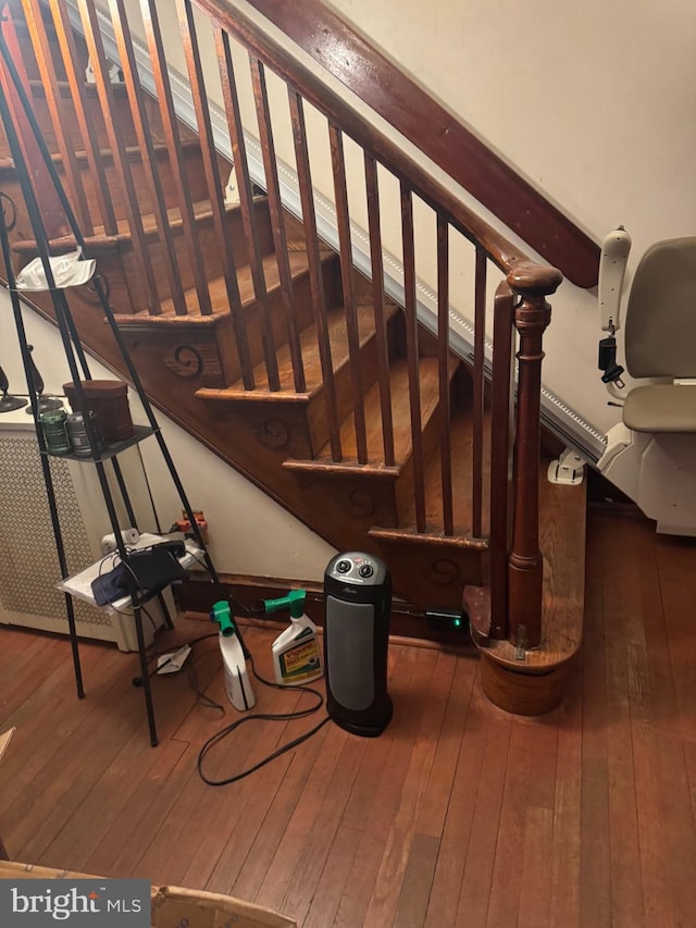 stairway with wood finished floors