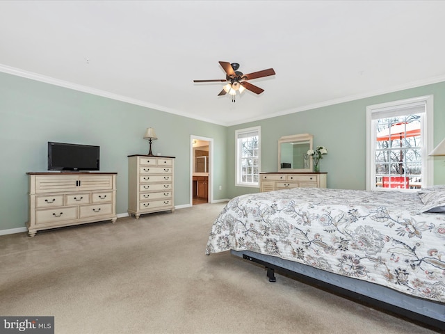 bedroom featuring light carpet, ensuite bath, baseboards, and ornamental molding