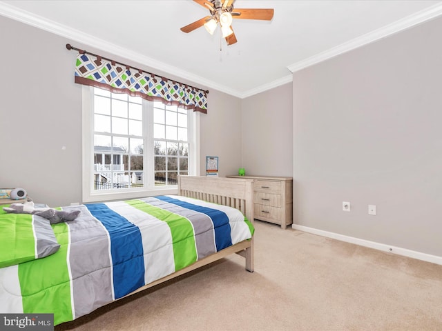 bedroom with a ceiling fan, light carpet, crown molding, and baseboards