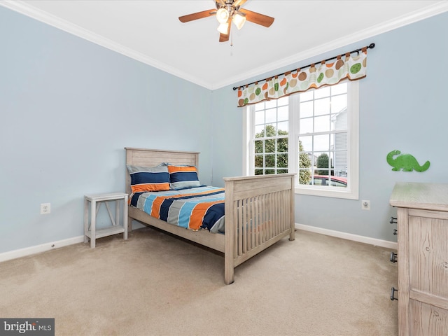 bedroom featuring light carpet, baseboards, a ceiling fan, and crown molding