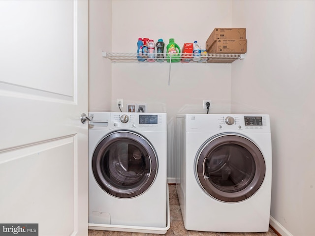 clothes washing area with washing machine and dryer and laundry area