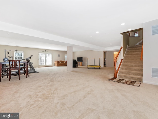 below grade area with recessed lighting, light carpet, visible vents, and stairs