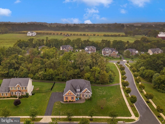 birds eye view of property with a residential view