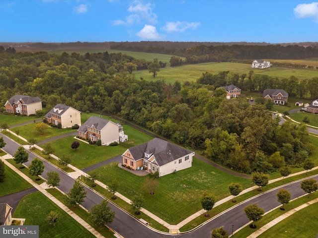 birds eye view of property with a residential view