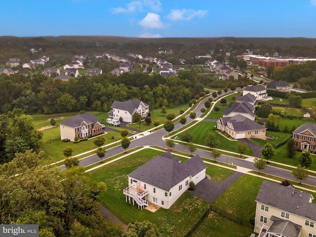 birds eye view of property with a residential view