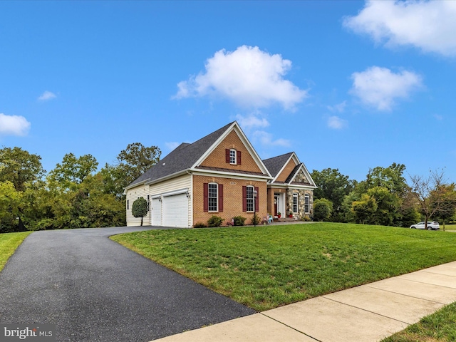 view of front facade with a garage, driveway, a front lawn, and brick siding