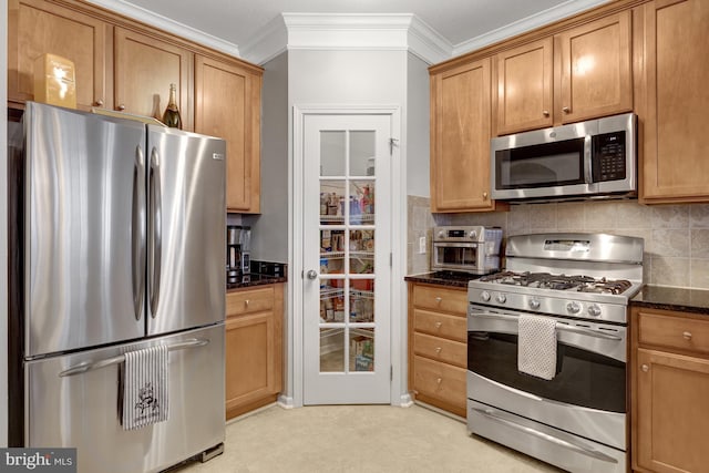 kitchen with tasteful backsplash, ornamental molding, stainless steel appliances, and dark stone countertops