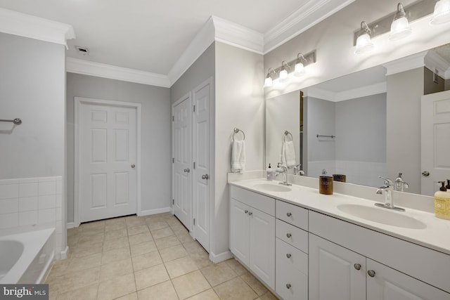 full bathroom with a garden tub, ornamental molding, and a sink