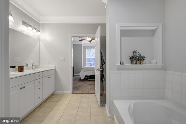 ensuite bathroom with a garden tub, tile patterned flooring, a sink, ornamental molding, and double vanity