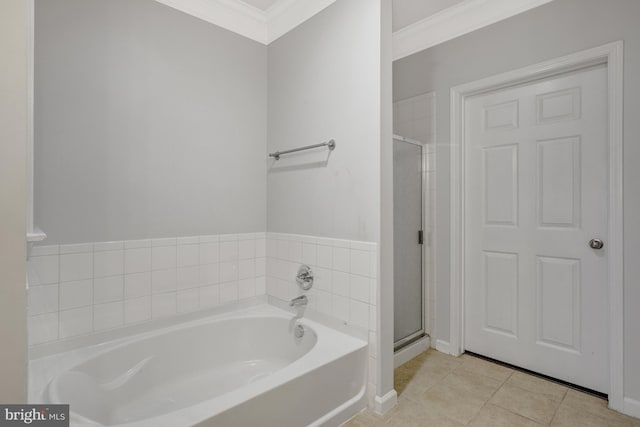 full bath featuring ornamental molding, tile patterned flooring, a bath, and a shower stall