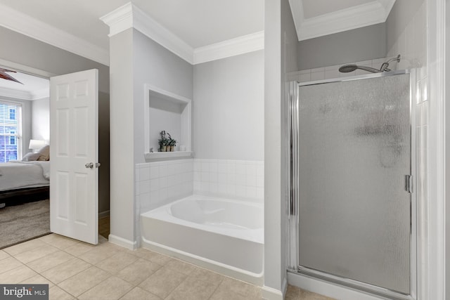 bathroom featuring ornamental molding, tile patterned flooring, and a shower stall