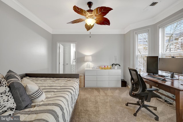 carpeted bedroom featuring a ceiling fan, visible vents, and crown molding