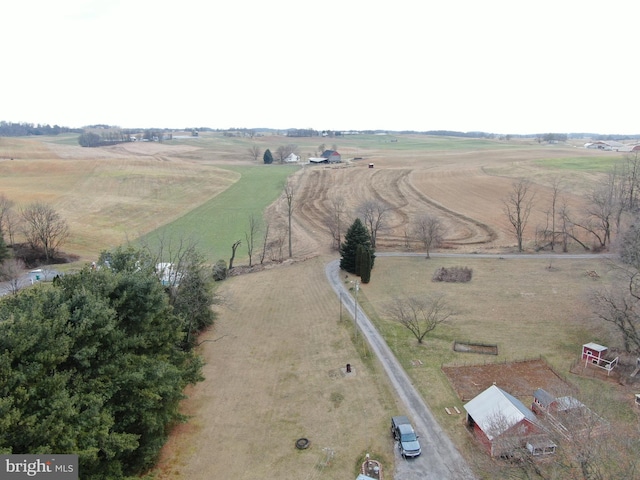 birds eye view of property with a rural view