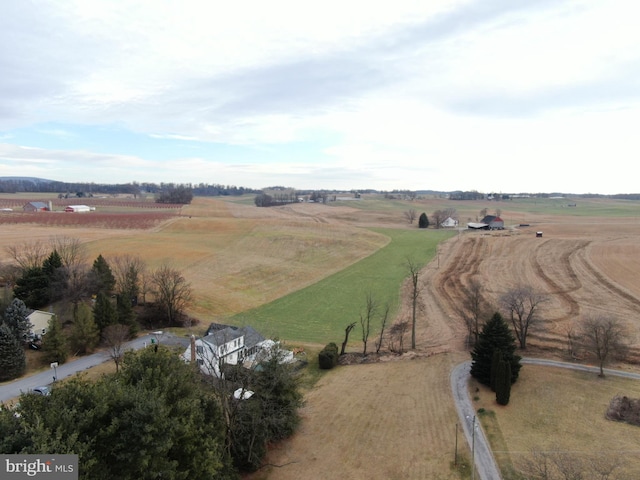 birds eye view of property featuring a rural view