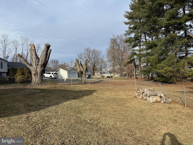 view of yard with a residential view and fence