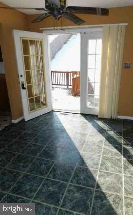 entryway with french doors and ceiling fan