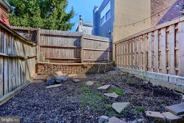 view of yard with a fenced backyard