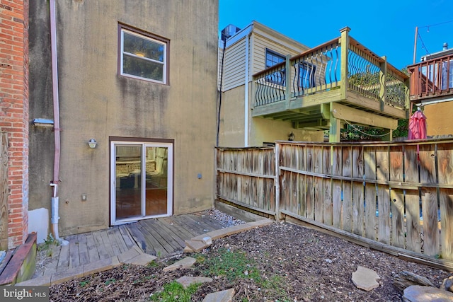 back of property featuring stucco siding