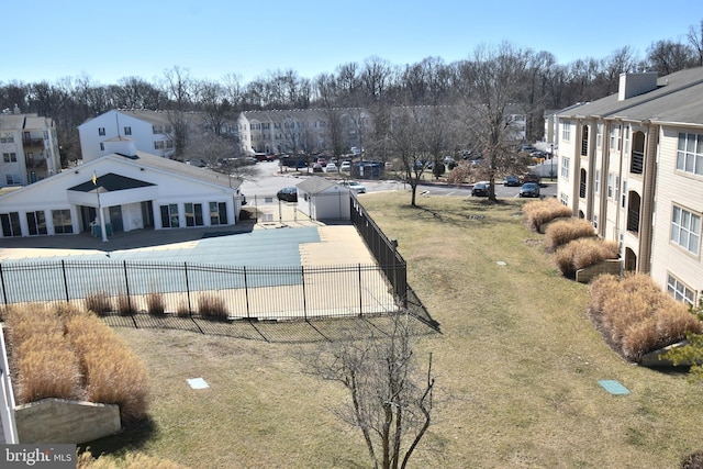 view of yard featuring a residential view and fence