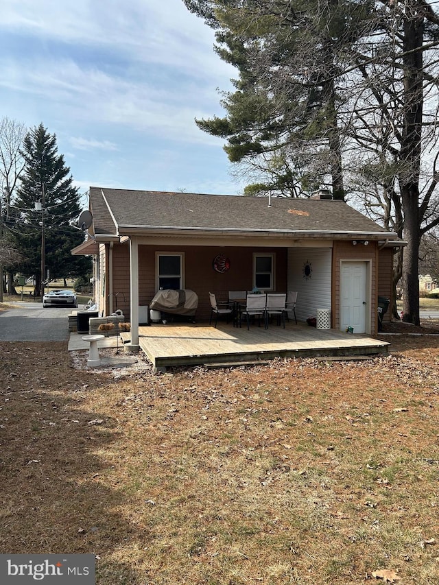 back of house featuring an outdoor hangout area