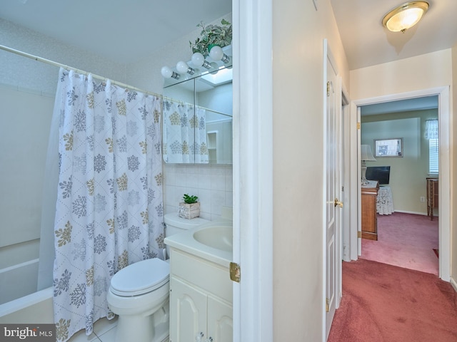 full bathroom featuring shower / bathtub combination with curtain, vanity, and toilet