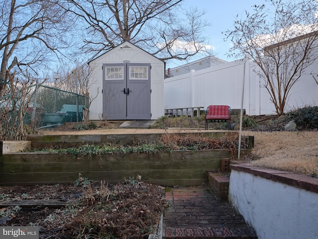 view of shed with fence