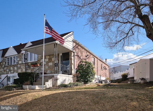 exterior space featuring a front lawn and a porch