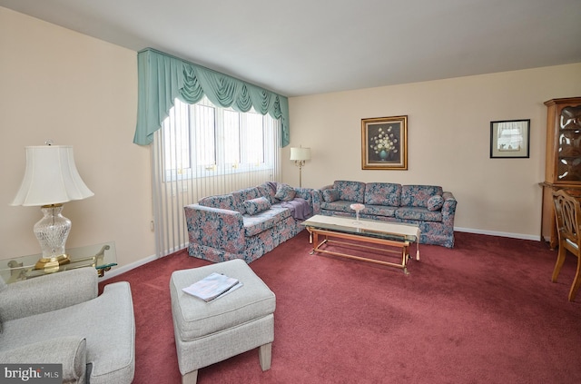 living area featuring carpet floors and baseboards