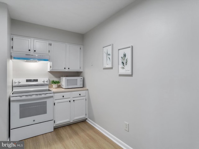 kitchen featuring light wood-style flooring, under cabinet range hood, white appliances, white cabinets, and light countertops