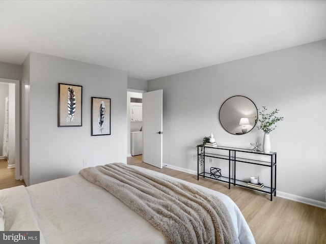 bedroom featuring light wood-style flooring and baseboards