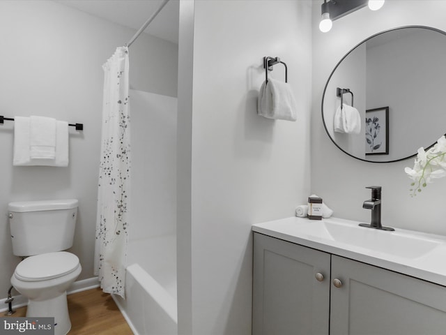 full bath featuring shower / tub combo with curtain, vanity, toilet, and wood finished floors