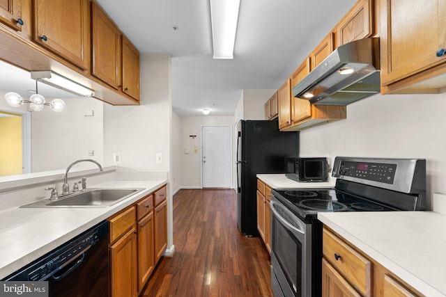 kitchen featuring stainless steel electric stove, light countertops, a sink, dishwasher, and under cabinet range hood