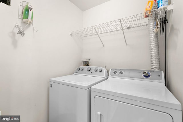 laundry area featuring laundry area and washer and dryer