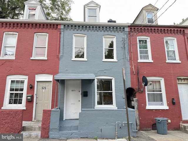 view of property featuring brick siding