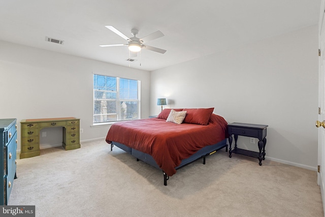 bedroom featuring light colored carpet, visible vents, and baseboards