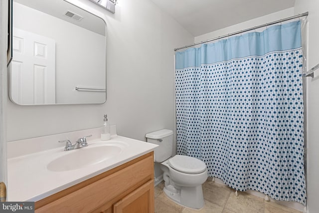 full bath featuring visible vents, toilet, tile patterned floors, curtained shower, and vanity