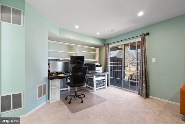 home office with light carpet and visible vents