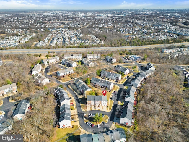 birds eye view of property with a residential view