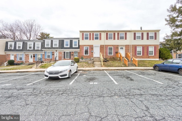 uncovered parking lot with a residential view